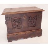 An early 18th century coffer Bach with carrying handles to sides, later scrollwork applied