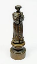 A 19th century bronze metamorphic erotic figure of a woman in gown opening to reveal a nude, screw