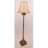 A Victorian brass standard lamp converted from an oil lamp 165cm tall