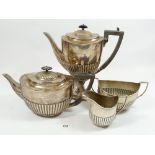 A silver four piece half gadrooned tea set comprising: teapot, sugar, jug and coffee pot, 1934g,