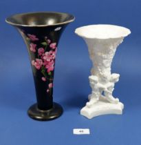 A Carlton Ware tall black vase printed blossom 25cm tall and a Spode Cornucopia vase