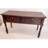 A 17th century oak low dresser with two drawers all raised on turned fruitwood legs, 140 x 55 x 84cm