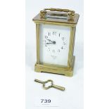 A brass cased French carriage clock with key