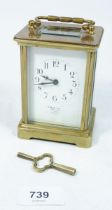 A brass cased French carriage clock with key