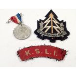 A Reconnaissance Corporals fabric badge, Two Kings Shropshire Light Infantry shoulder badges and a