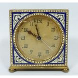 An Art Deco alarm clock with blue and white enamel decoration, 7 x 7 x 2cm