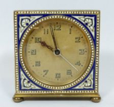 An Art Deco alarm clock with blue and white enamel decoration, 7 x 7 x 2cm