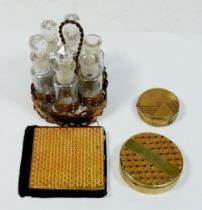 An Art Deco Nilde compact, another compact, a mirror and a miniature set of six perfume bottles in