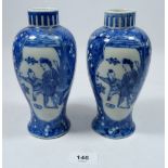 A pair of 20th century Chinese blue and white baluster vases painted woman and child on prunus