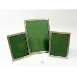A set of three silver engine turned photograph frames Birmingham 1950, 1958 and 1954, 19 x 14cm