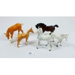 A collection of five Beswick foals