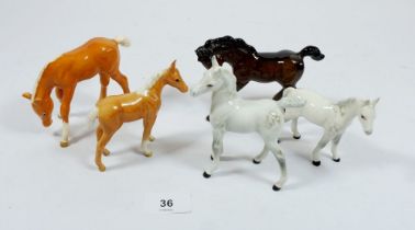 A collection of five Beswick foals