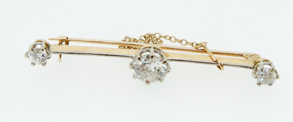 An 18 carat and platinum gold bar brooch set central diamond (1.48cts) flanked by two further - Image 2 of 5