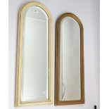 A pair of narrow arch top bevelled mirrors, 71 x 26cm