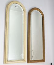 A pair of narrow arch top bevelled mirrors, 71 x 26cm