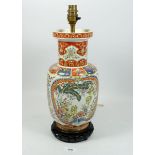 A vintage Chinese table lamp marked Hong Kong, 34cm tall