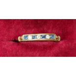 A 9 carat gold ring set sapphires and three diamonds, size P to Q