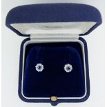 A 9 carat white gold pair of sapphire and diamond earrings (studs) 6mm total diameter