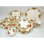 A Royal Albert Country Roses group of china includng: oval dish, two cake plates, two cake stands,