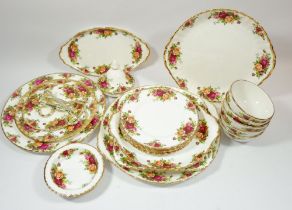 A Royal Albert Country Roses group of china includng: oval dish, two cake plates, two cake stands,