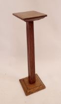 A 1930's oak shop display stand from Brays of Malvern, 60cm high