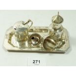Two silver plated miniature wine funnels and a white metal part eastern cruet set