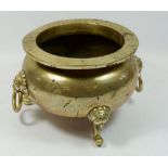 A Chinese brass jardiniere with mask and ring handles, 27cm diameter