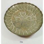 An Eastern white metal tray with engraved foliage decoration, 39.5cm diameter