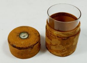 A Victorian glass travelling tumbler in leather box with mother of pearl faced compass inset to