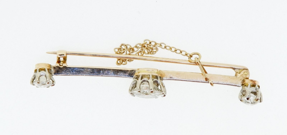 An 18 carat and platinum gold bar brooch set central diamond (1.48cts) flanked by two further - Image 5 of 5