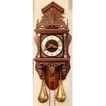 An English made copy of a Dutch striking wall clock with weights and pendulum, 53cm tall