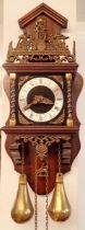 An English made copy of a Dutch striking wall clock with weights and pendulum, 53cm tall