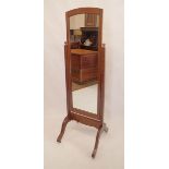 An early 20th century oak cheval mirror