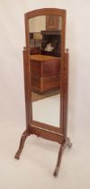 An early 20th century oak cheval mirror