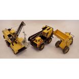Three Tonka toys including Mighty Tonka Loader and two cranes, roughly 45cm long