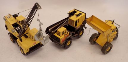 Three Tonka toys including Mighty Tonka Loader and two cranes, roughly 45cm long