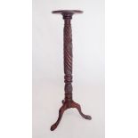 A Victorian large carved mahogany torchere stand on triple supports 133cm tall