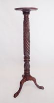A Victorian large carved mahogany torchere stand on triple supports 133cm tall