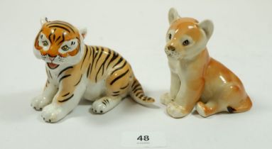 A Russian tiger and lion cub