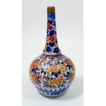 A Japanese Imari bottle form vase with floral decoration, 19cm