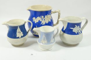 Four various Victorian jugs with applied decoration, tallest 19cm