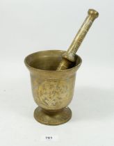 A North African large brass pestle and mortar, 15cm
