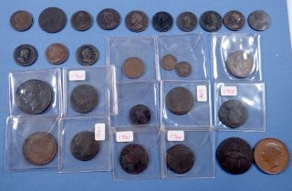 A quantity of copper/bronze coinage and token including: farthings, halfpennies, pennies, half