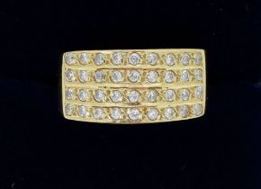 An 18 carat gold ring set panel of white stones, size M, 4g