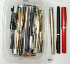 A box of fountain pens and ball point pens