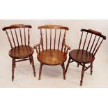 Three early 20th century beech stick back chairs (one carver and two carvers)