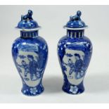 A pair of Meiping blue and white vases with lids, base mark 'Kangxi Nianzhi', 17cm tall