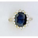 An 18 carat gold diamond and sapphire cluster ring, not marked - size Q to R