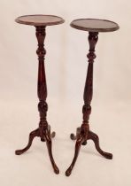 A pair of mahogany carved torchere stands 107cm tall