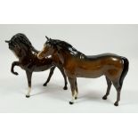 Two Beswick standing brown horses, one with raised hoof